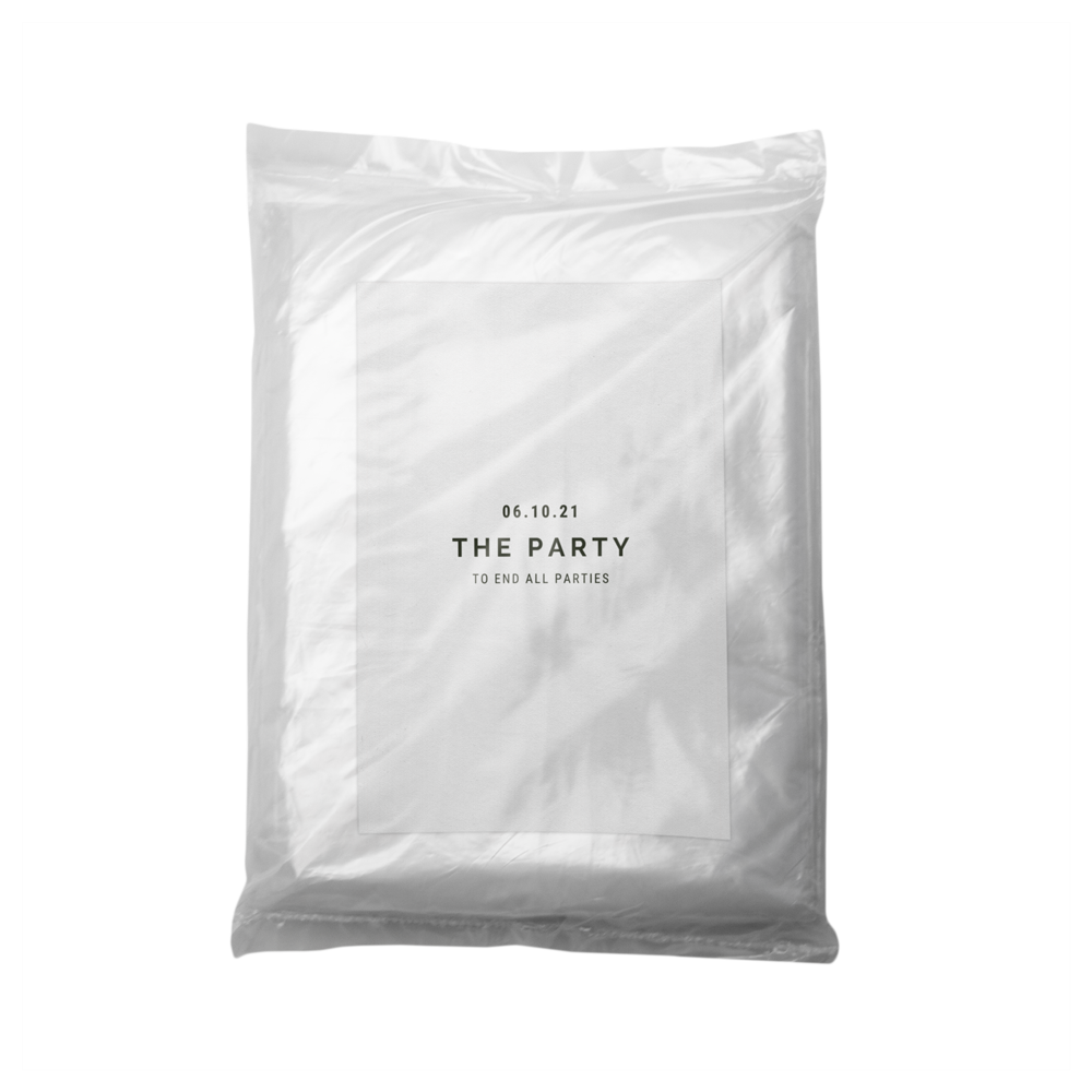 Bio-Regenponcho HANS im Beutel mit individuell bedrucktem Etikett.