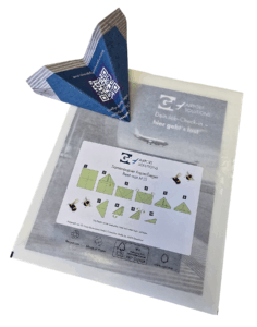 Samenpapier-Flieger gefaltet mit Verpackung