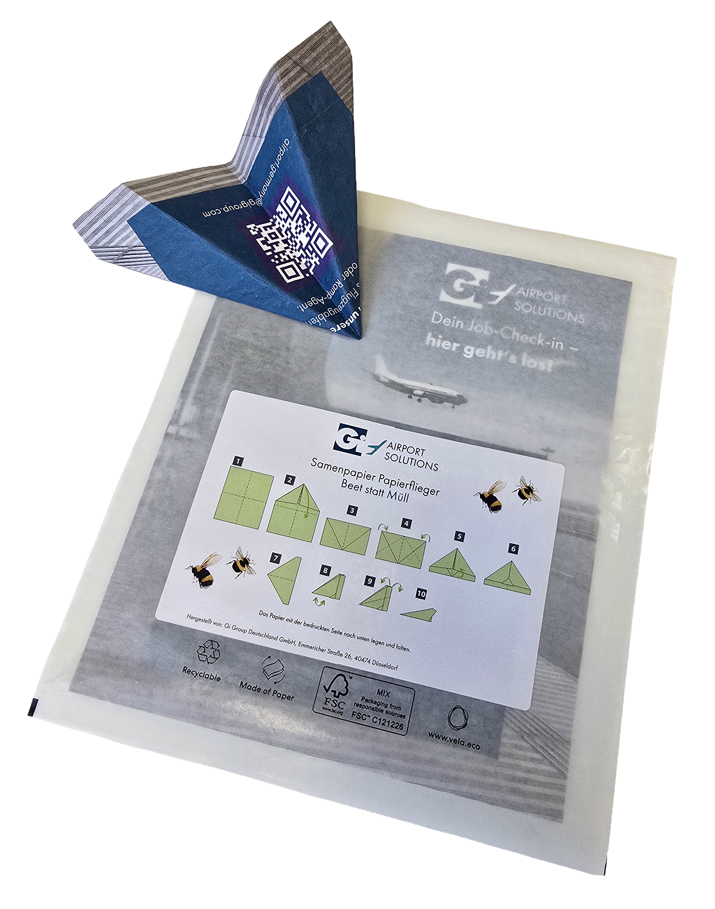 Samenpapier-Flieger gefaltet mit Verpackung