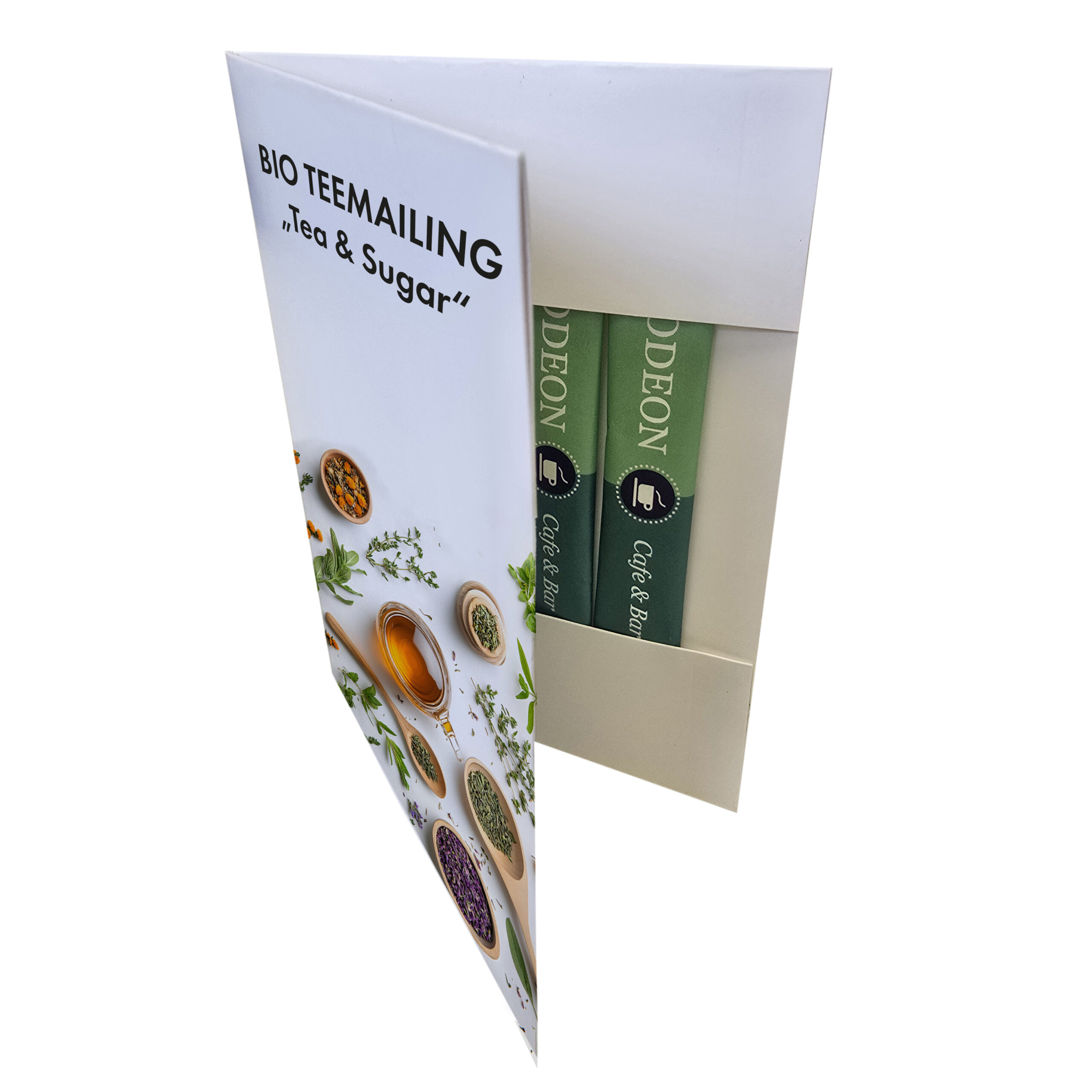 Kreatives Mailing mit Sonnentor-Tee und Zuckersticks in Klappkarte.
